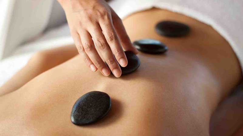 Visit Divine Day Spa for a heavenly hot stone massage - A top to toe indulgence to relieve aching bodies.